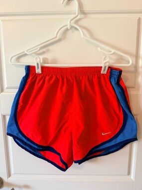 Nike Women’s Redish Orange Athletic Shorts with Blue Trim